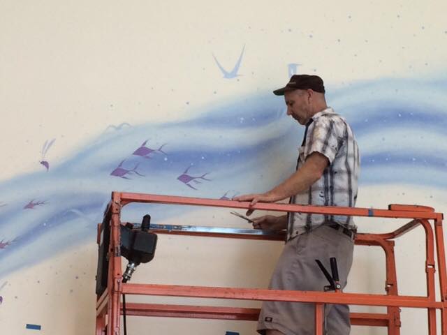 J Shea mural in progress